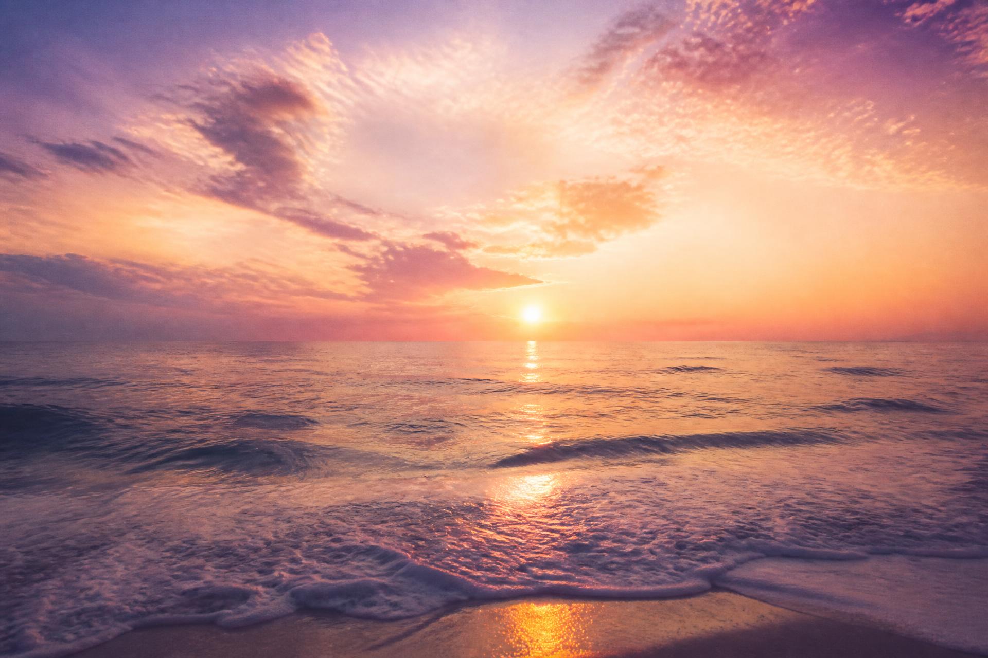 Cinematic sunrise over the ocean with lavender and gold skies